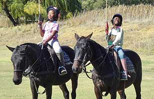 Two poloafrica girls first stick and ball lesson